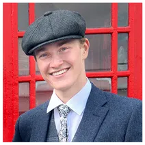 Daniel Grant, in front of a red telephone box in Oxford